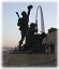 Anna-and-dad-with-Louis-and-Clark-Statue-and-St.Louis-Arch