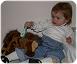 Anna-combing-the-mane-of-her-stuffed-horse-042804