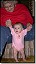 Anna-trying-to-stand2-with-Grandma-Fedel-010403